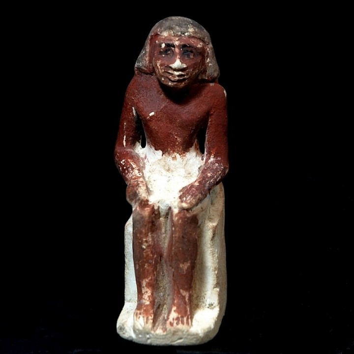 Limestone Figure of a Seated Man