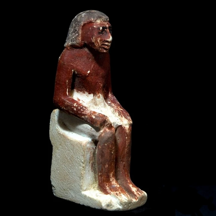 Limestone Figure of a Seated Man