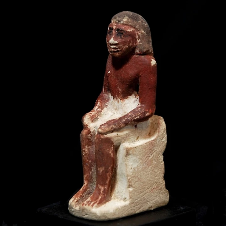 Limestone Figure of a Seated Man